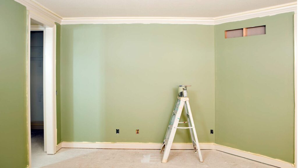 bedroom wall painting with color-matched baseboard trim