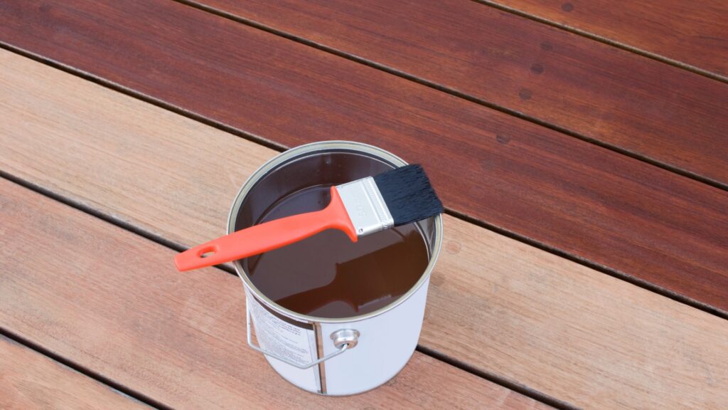 deck staining in progress using oil-based finish