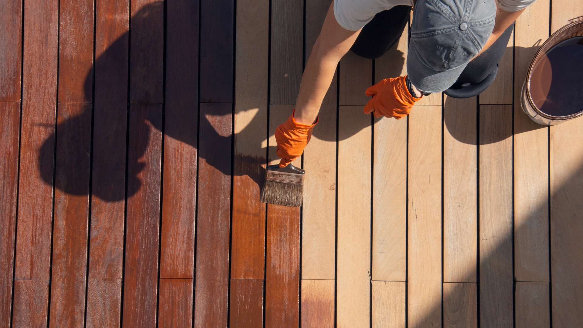 sun-faded deck being stained and sealed by Largo painters