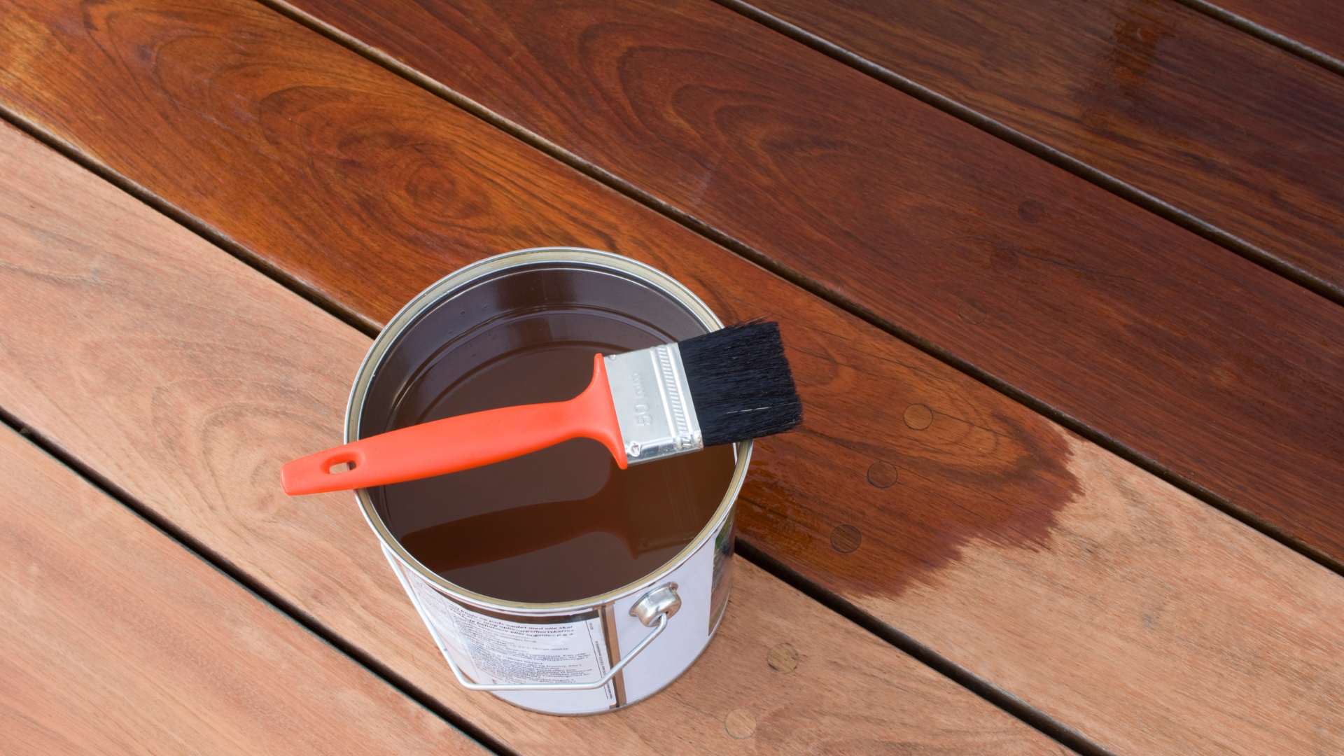 Seminole wood deck receiving two-coat oil-based stain and sealer finish
